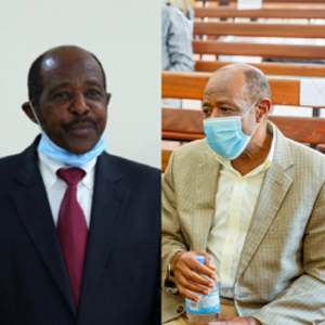 Two side by side photos of Paul Rusesabagina wearing a black suit with a red tie and a grey suit without a tie as he wears a mask during Rwandan court proceedings during his illegal detention.